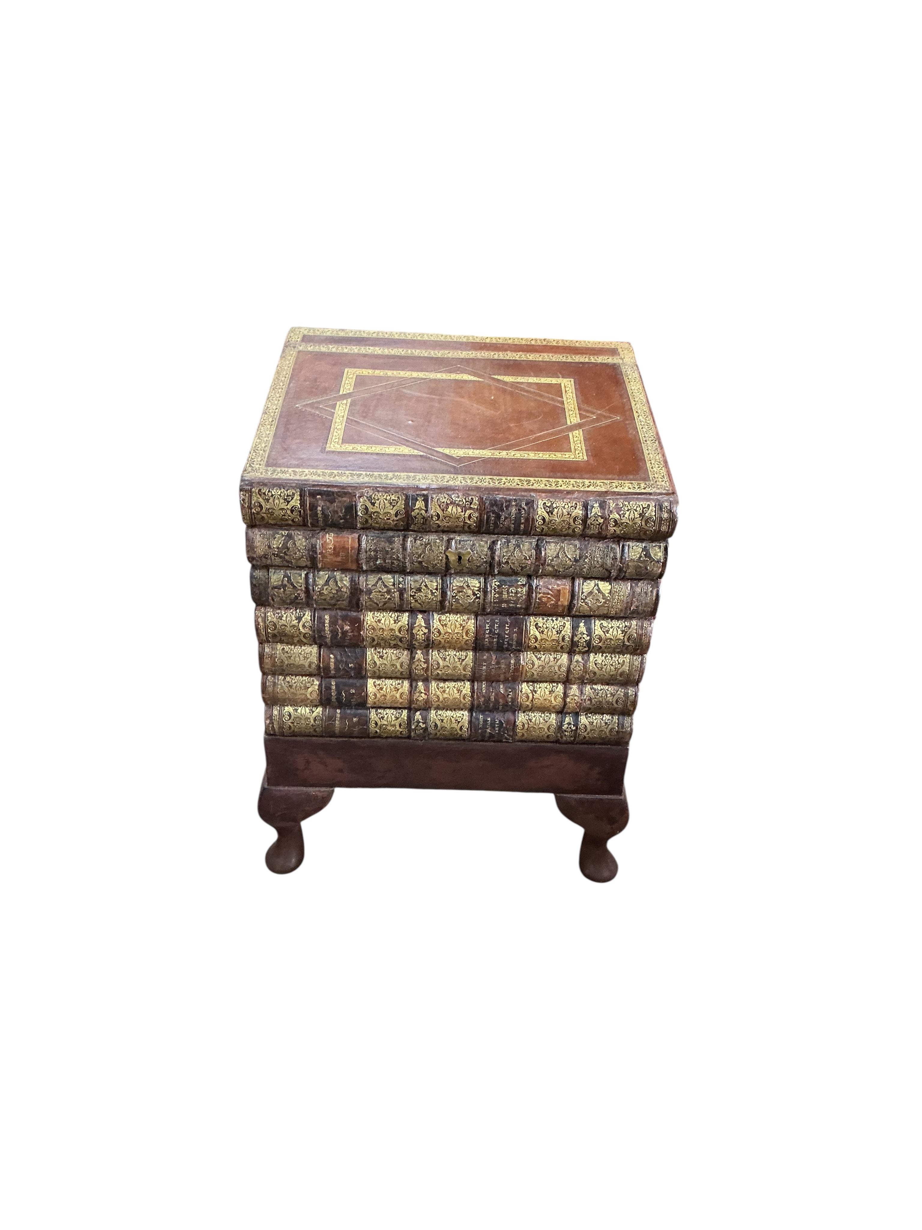 A reproduction cellarette modelled as a stack of antiquarian books, width 42cm, depth 37cm, height 58cm